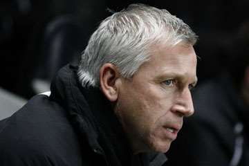 Alan Pardew in the dugout.