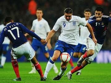 Andy Carroll in action against France.