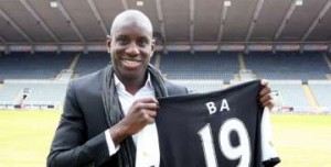 Demba Ba signs for Newcastle.